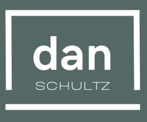 Logo of a person's name written in a laptop outline